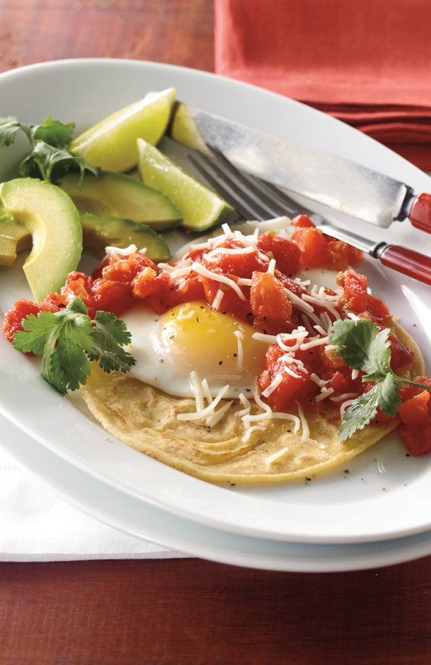 Spanish for ranchers eggs Huevos Rancheros consists of fried eggs on corn - photo 8