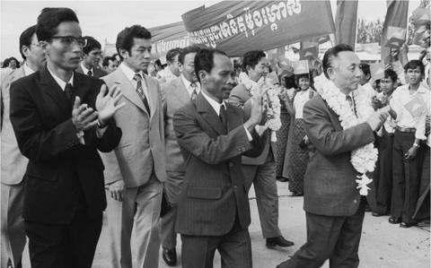 4 The new masters of Cambodia Heng Samrin center and Pen Sovan left greet - photo 6