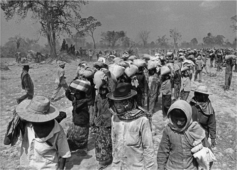 8 Cambodian peasants carry international food aid back to their farms via the - photo 10