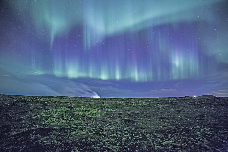 Northern Lights Watching the green and white lights dance and flicker in the - photo 15