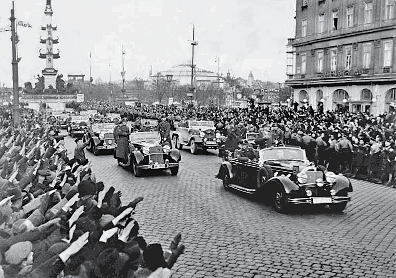 Riding triumphantly at the head of his motorcade German Fhrer Adolf Hitler is - photo 4