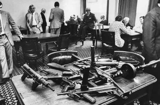 Machine guns on the table at the Victorian Club site of the Great Bookie - photo 11