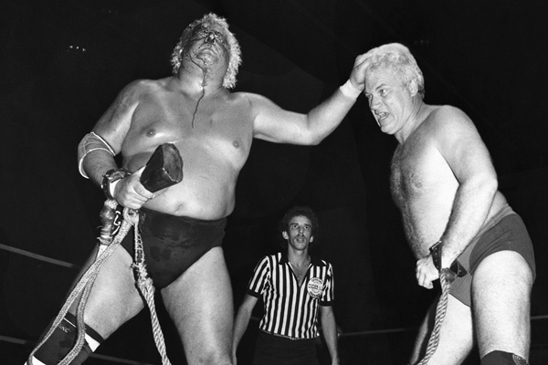 A bloody Dusty Rhodes battles JJ Dillon in a bullrope match in Florida in - photo 4