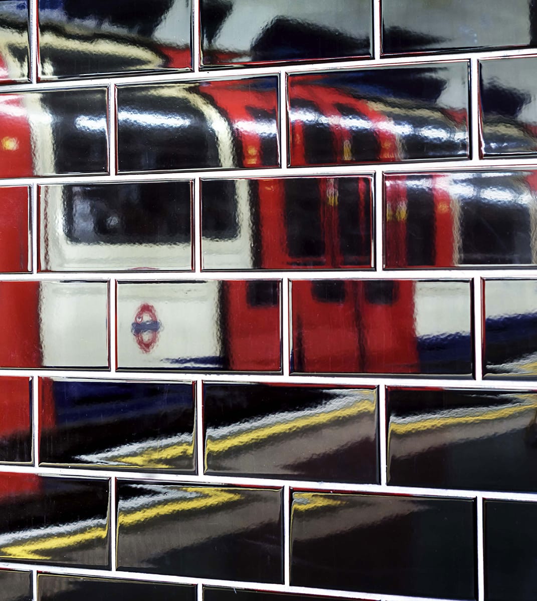 A Tube train reflected in the platform tiling at Marble Arch station on the - photo 2