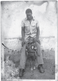 Me as a young boy standing with my father in Masitala village To me he was - photo 3