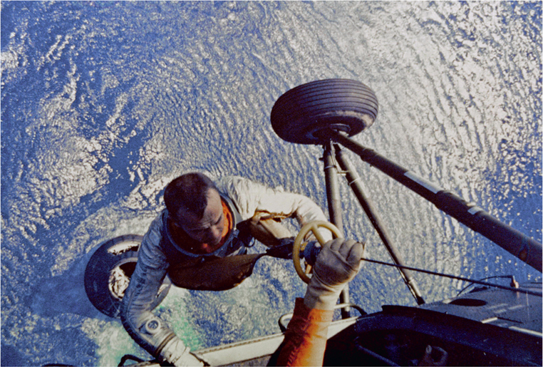 Alan Shepard being hoisted into a US Marine helicopter after completing his - photo 6