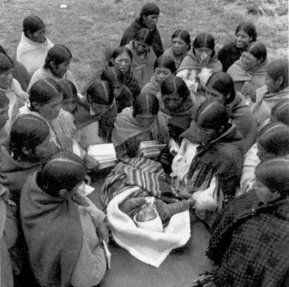 Midwife teaching Aymara women childcare in Peas Bolivia Page - photo 2