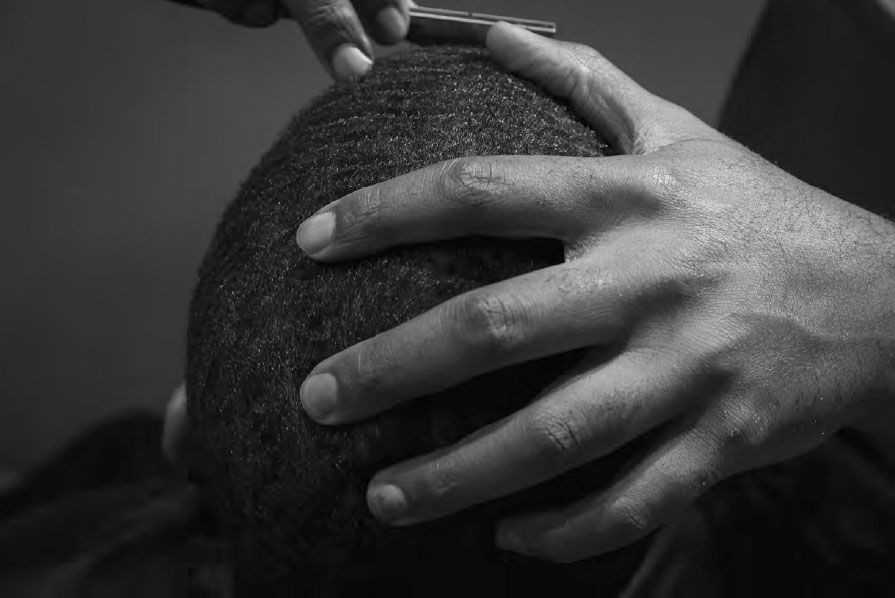 Donald Perry holds a clients head still while giving him a lineup The Grain - photo 4