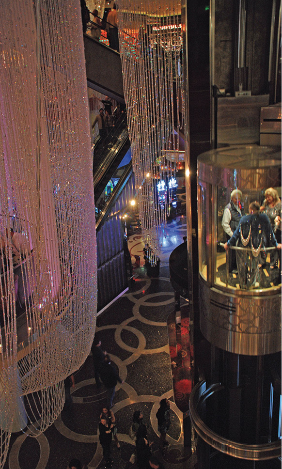 Glam chandeliers are draped throughout the lobby of The Cosmopolitan - photo 11