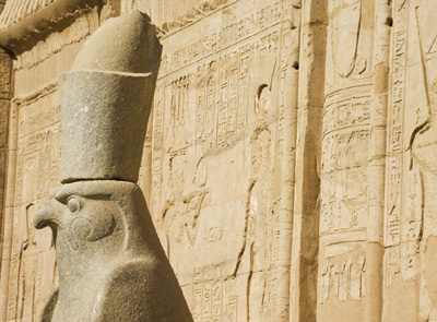 A statue of the Egyptian god Horus outside the sandstone Temple of Horus at - photo 5