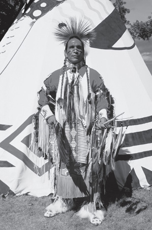 A man in dance regalia at the United Tribes Powwow in Bismarck ND - photo 16