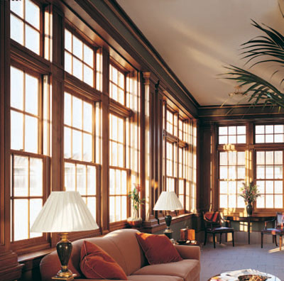 These triple-sash double-hung windows create walls of light and a lovely - photo 12