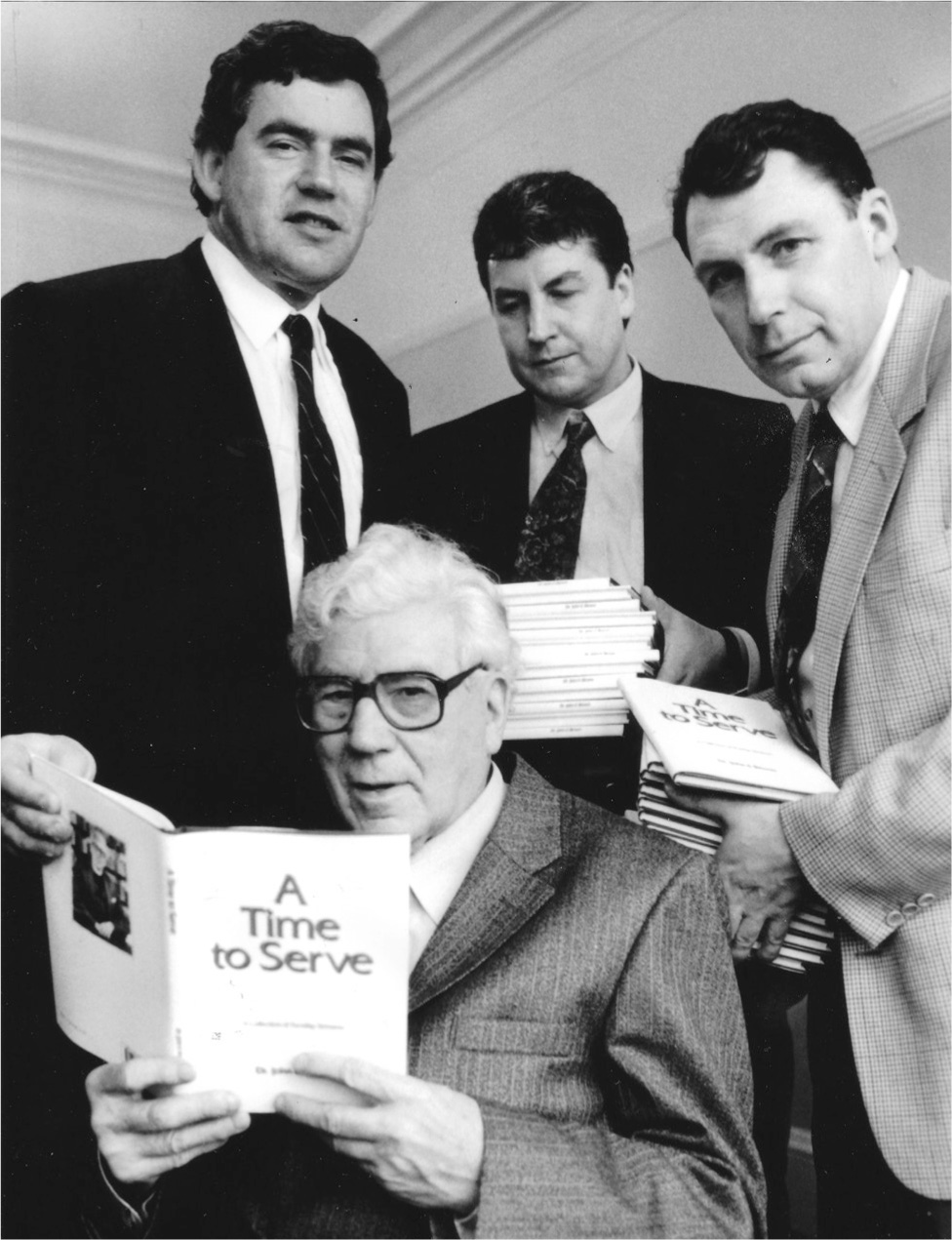 My father holding the book of his sermons that my brothers John and Andrew - photo 9