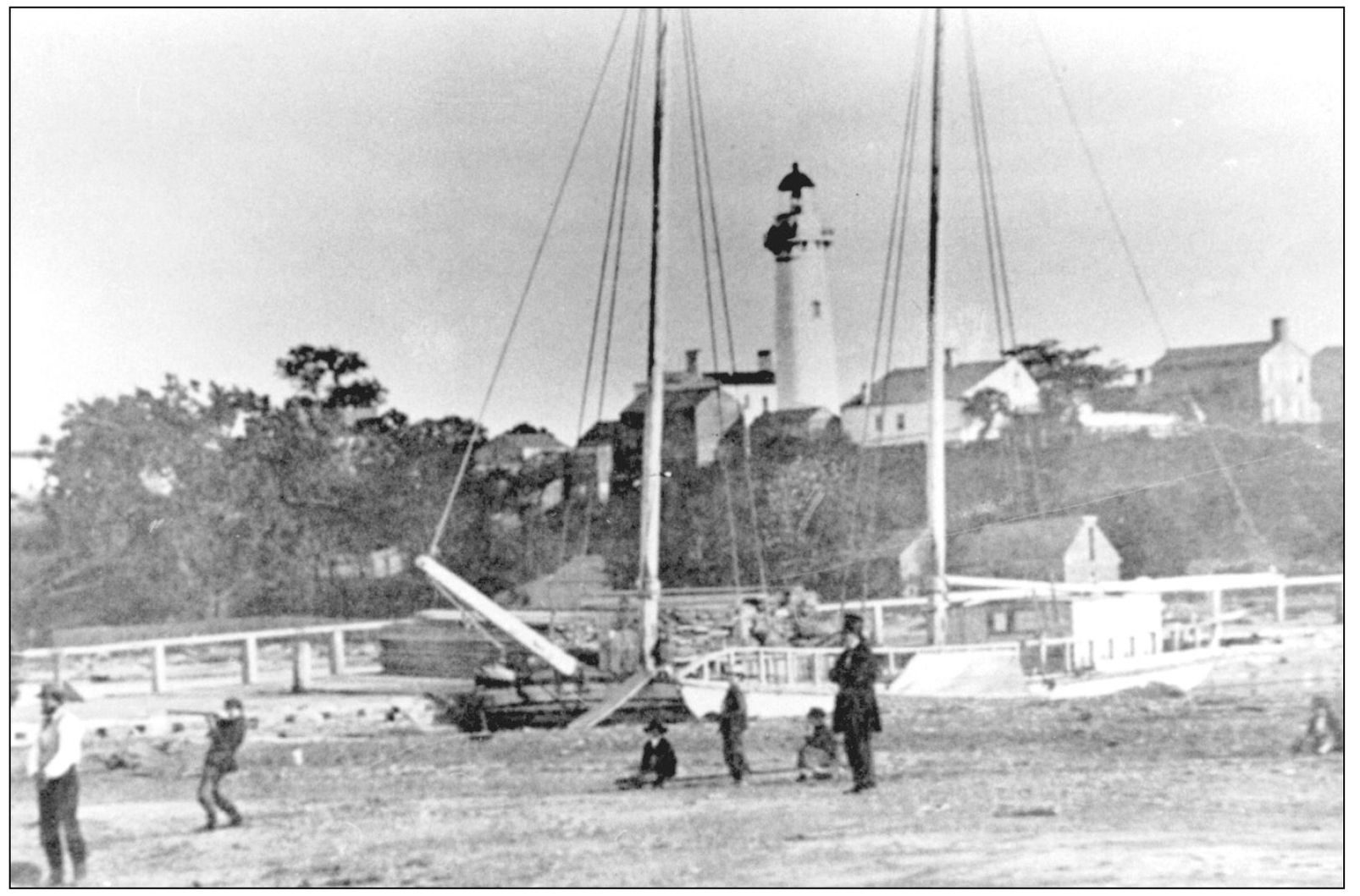 This 1858 photo shows a sailing vessels masts framing the 1825 lighthouse It - photo 6