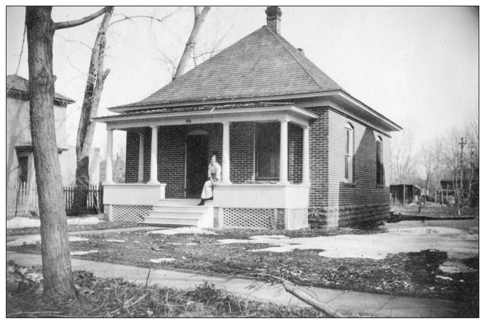 Effie perches on the porch of the Longmont house at 438 Collyer Street Though - photo 7