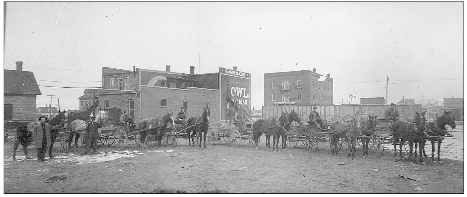 A horse and buggy lineup sits in the west alley of the 400 block of Box Butte - photo 11