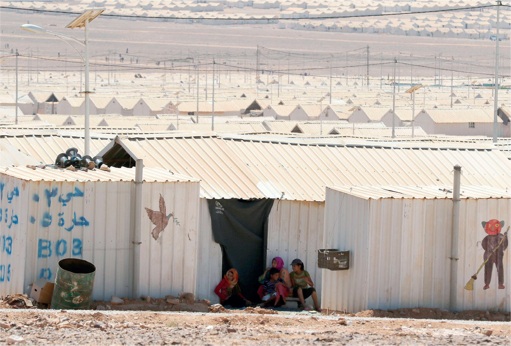 Syrian children at the recently designed Azraq refugee camp in northern Jordan - photo 6