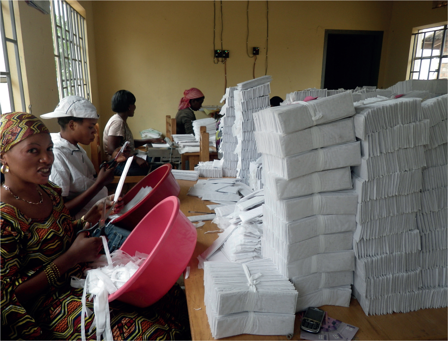 Refugees making biodegradable sanitary pads at a social enterprise in Kyaka II - photo 14