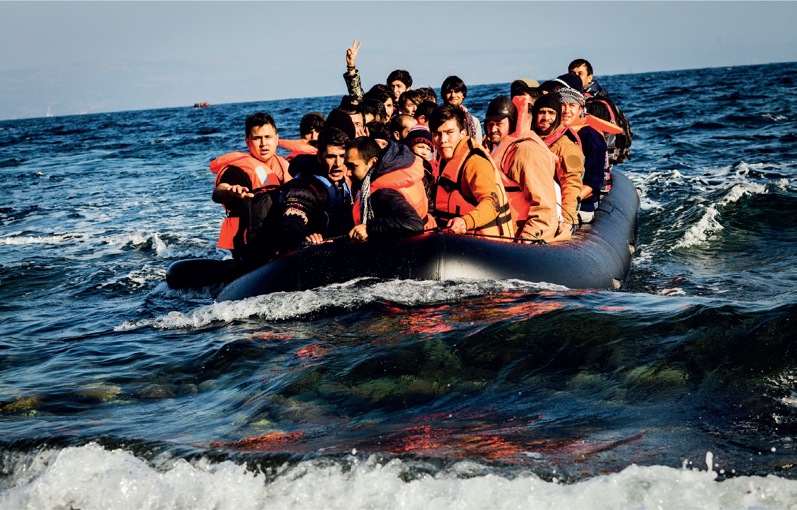 Syrian men embark on the perilous journey across the Aegean Sea Around 8500 - photo 17