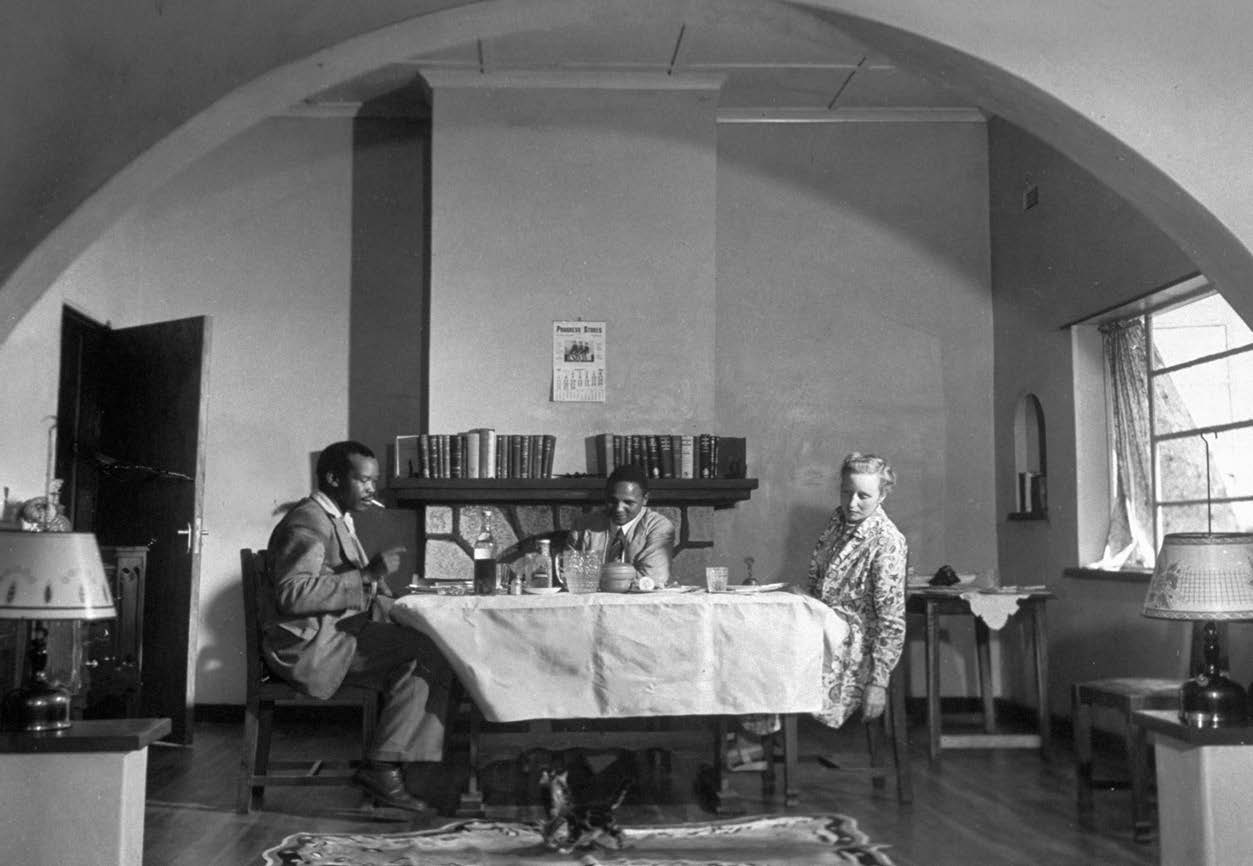 Seretse and Ruth sharing a meal with Seretses friend Kgosi Mokgosi of the - photo 7