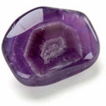 A polished amethyst showing concentric rings formed during the crystals - photo 7