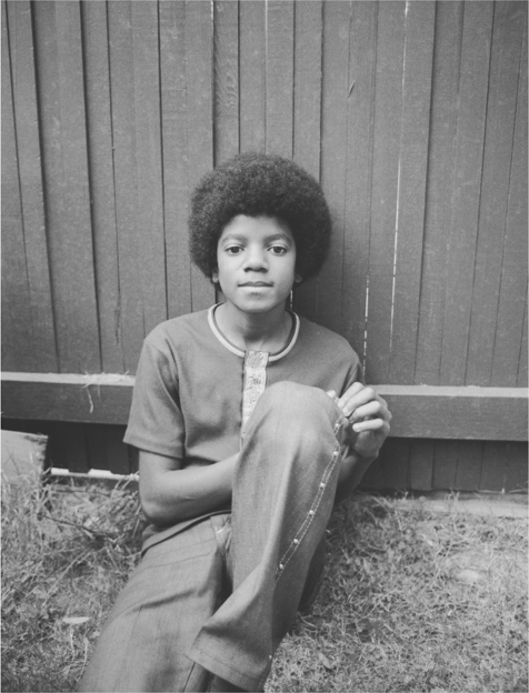 Michael poses with his younger sister Janet at the family home in the - photo 8