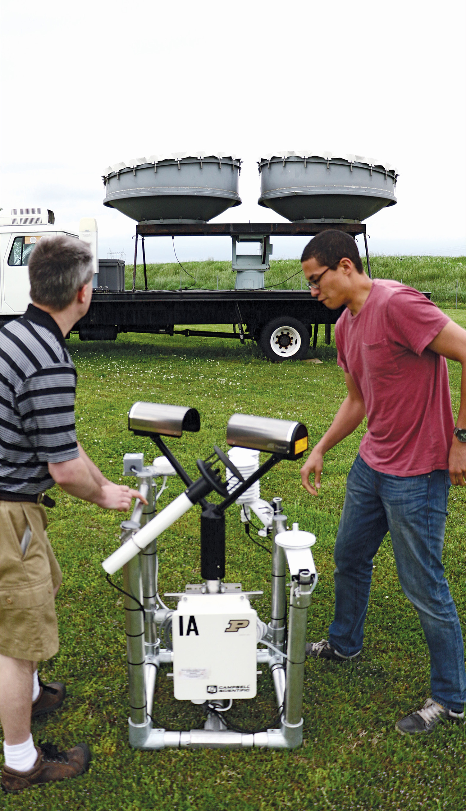 Dan Dawson and a colleague carry a PIPS near a radar truck Its made to be - photo 1