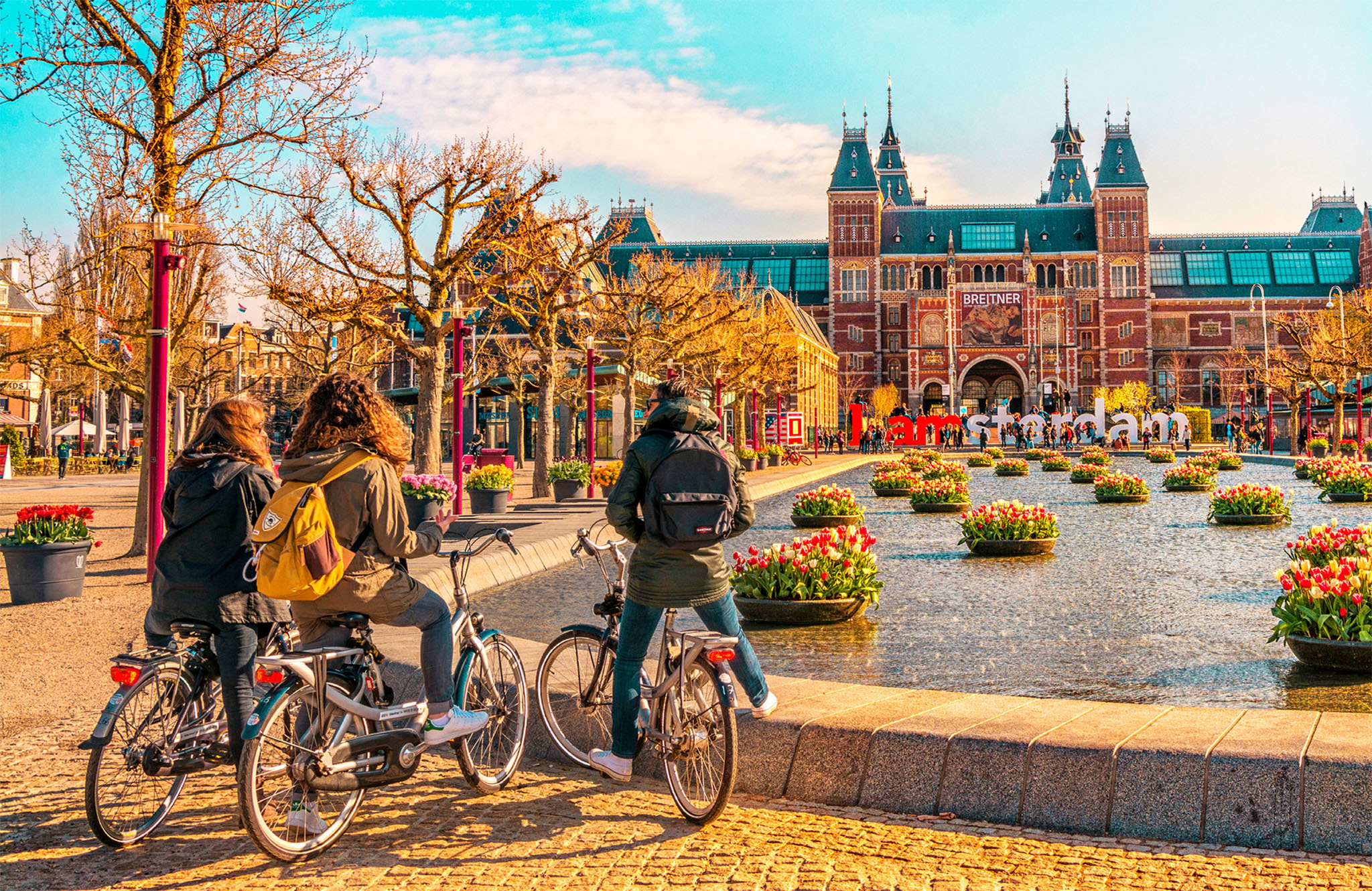 t Cyclists pause to admire the Rijksmuseum With its reflective waterways - photo 5