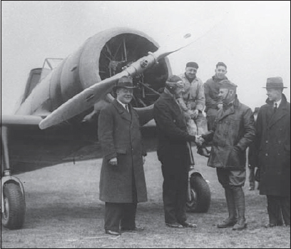 The first three men to fly the DXXI pose in front of the prototype after its - photo 3