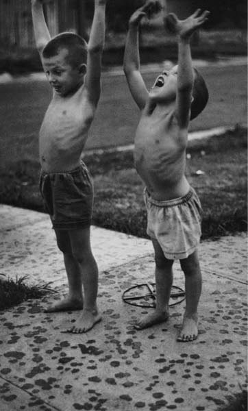 Boys standing in raindrops after a drought El Dorado Feed mixer for - photo 12