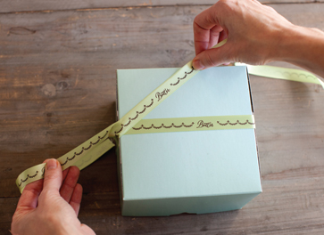 Wrap the balance of the ribbon on the 3 side under the box and come up at the - photo 8