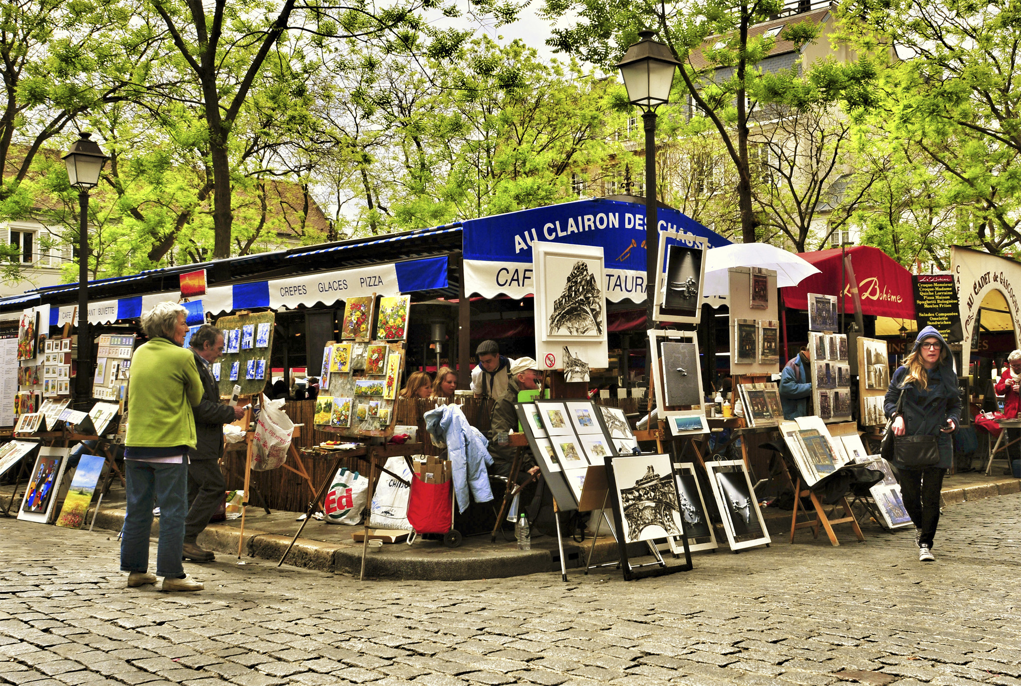 Montmartres leafy Place du Tertre is always crowded with artists at their - photo 6