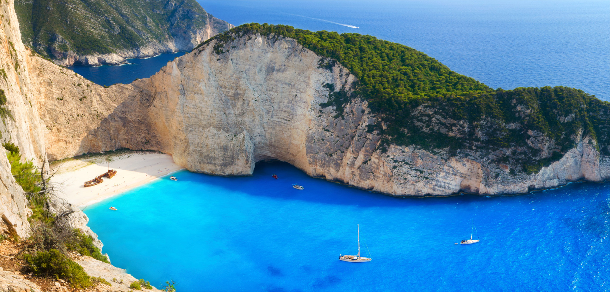 t A golden arc of sand protected by towering cliffs with the remains of an old - photo 9