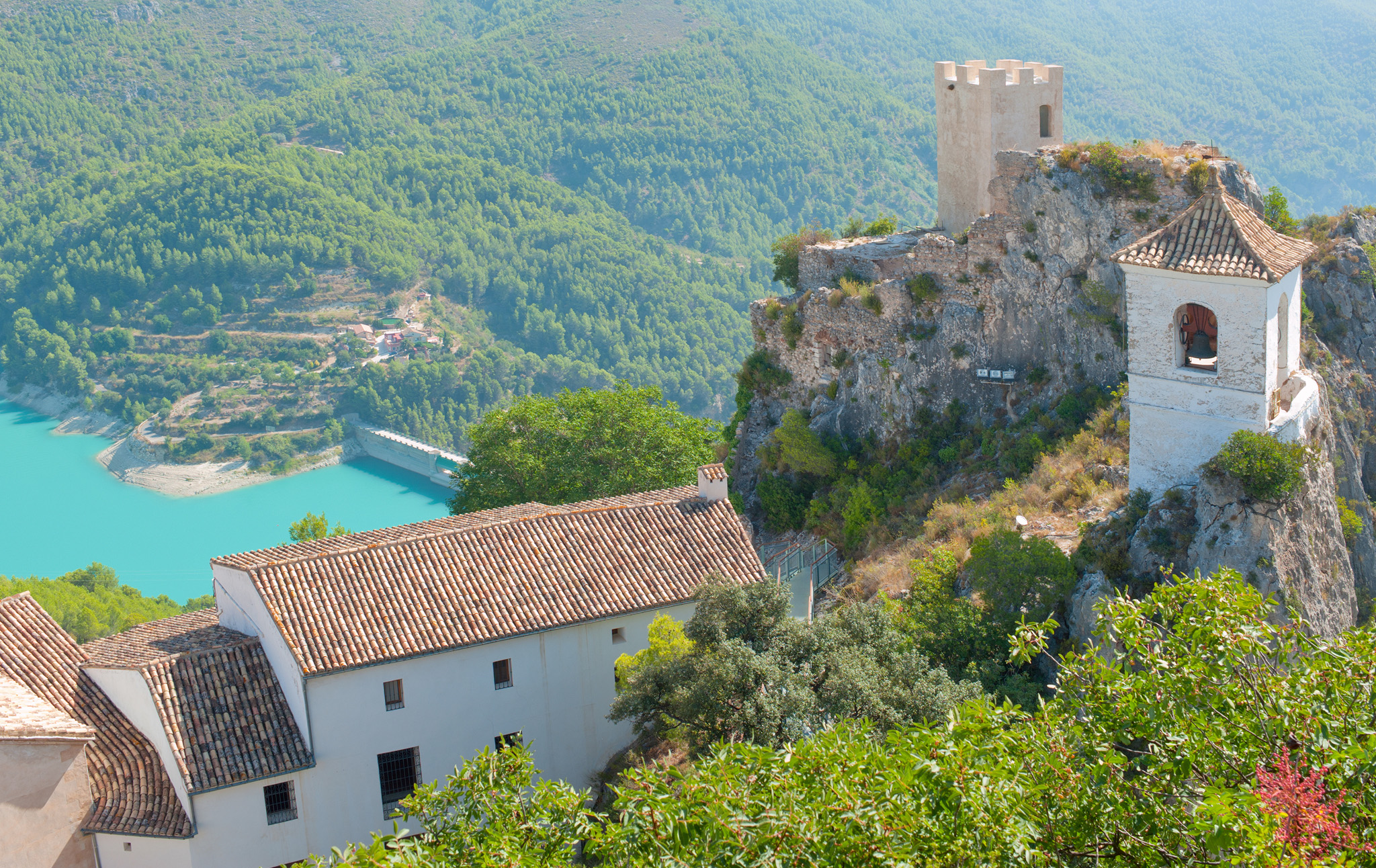 The picturesque mountain village of Guadalest is topped by castle ruins and - photo 13