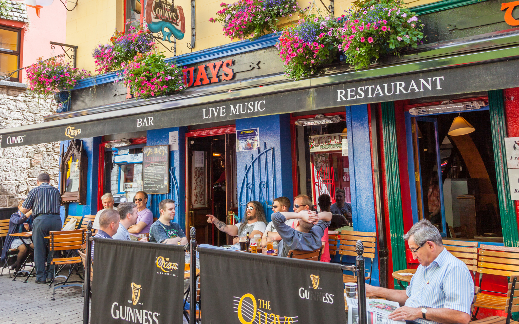 Visitors sitting outside Quays Bar in Galway City Top 10 Dublin - photo 5