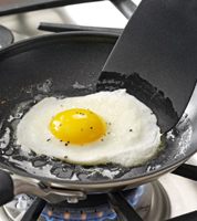 Break egg into a cup and gently slide into pan Reduce heat to low Cook - photo 10