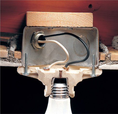 Inexpensive light fixtures have screw terminals mounted directly to the - photo 10