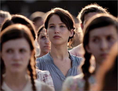 Katniss Everdeen Jennifer Lawrence stands in the crowd during the District 12 - photo 4