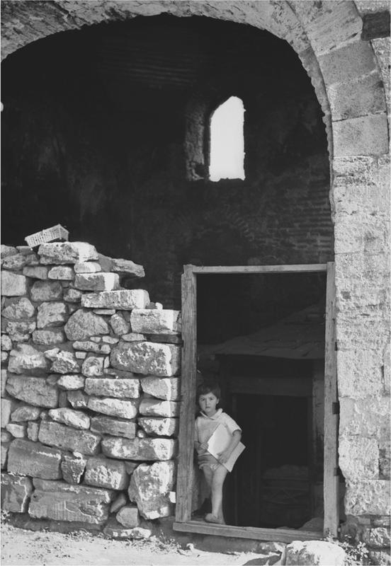 Child standing in front of the Byzantine city walls Evliya the son of - photo 1