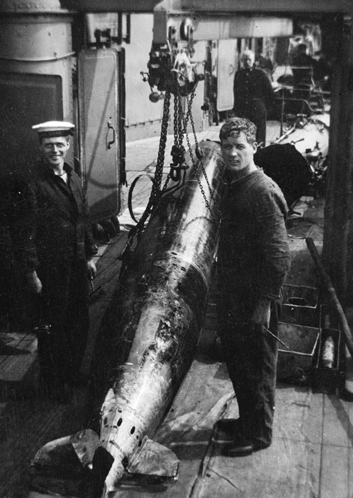 A torpedo slung from a hoist on board the cruiser Aurora 1915 N22862 - photo 8