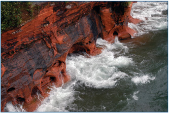 Wisconsins Bayfield caves were formed by water wearing down huge rocks over a - photo 7