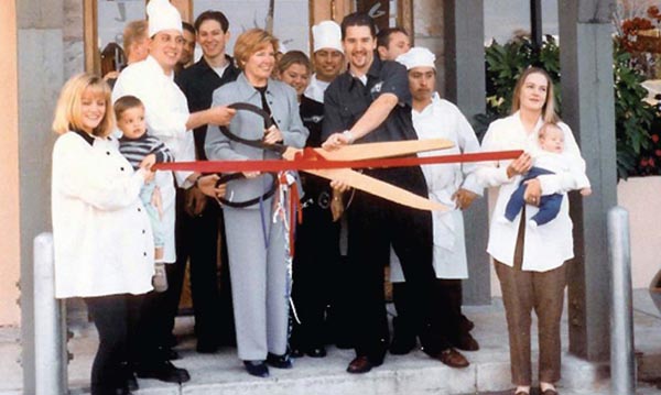 Cutting the ribbon at Johnny Garlics in Santa Rosa The small boy on the left - photo 4