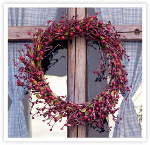 A festive garland hangs on a door in Finland The Norwegian tundra - photo 7