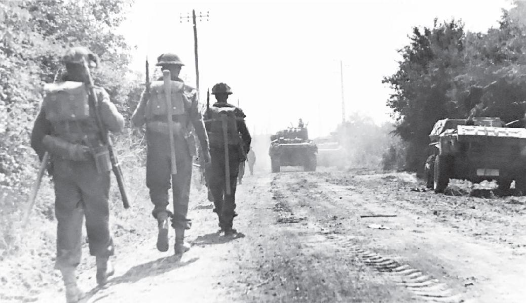 British troops advancing Shermans assembling for Operation EPSOM - photo 27