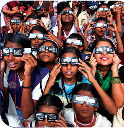 Observers watch the January 15 2010 annular solar eclipse at the central - photo 9