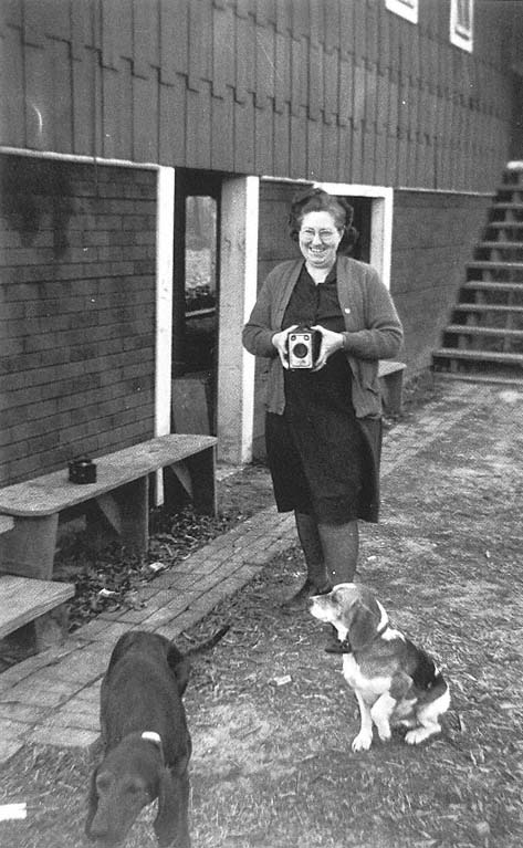 Florence Huffman with dogs and two of her cameras Ten Point clubhouse - photo 6