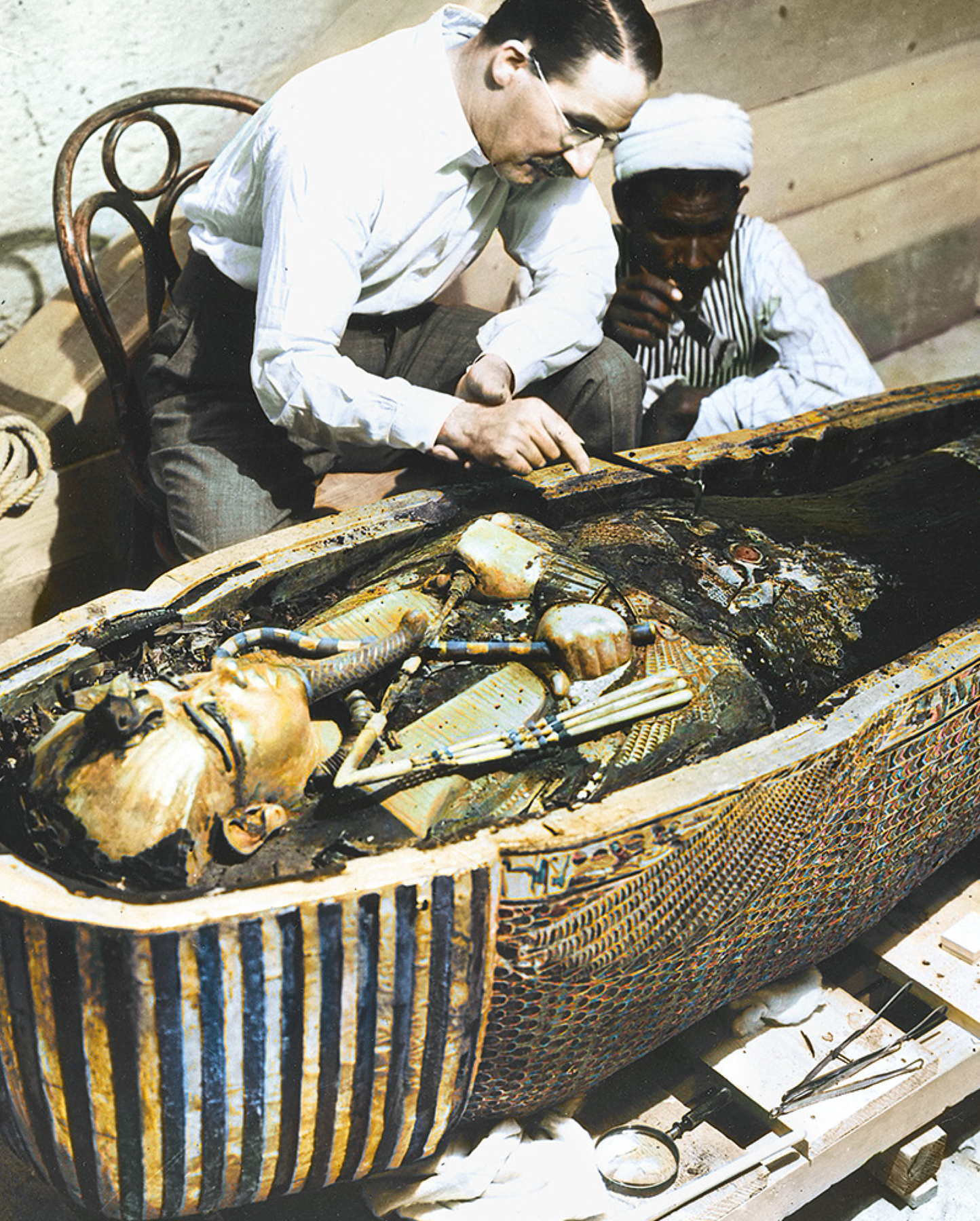 The archaeologist Howard Carter examines the coffin of the Egyptian pharaoh - photo 5