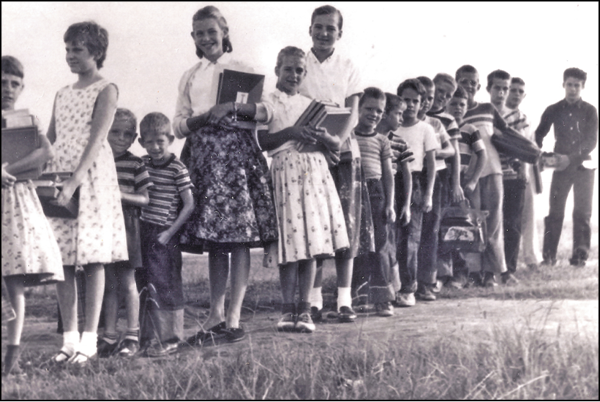 Seventeen Koinonia children waiting for the school bus mid-1950s Courtesy of - photo 3