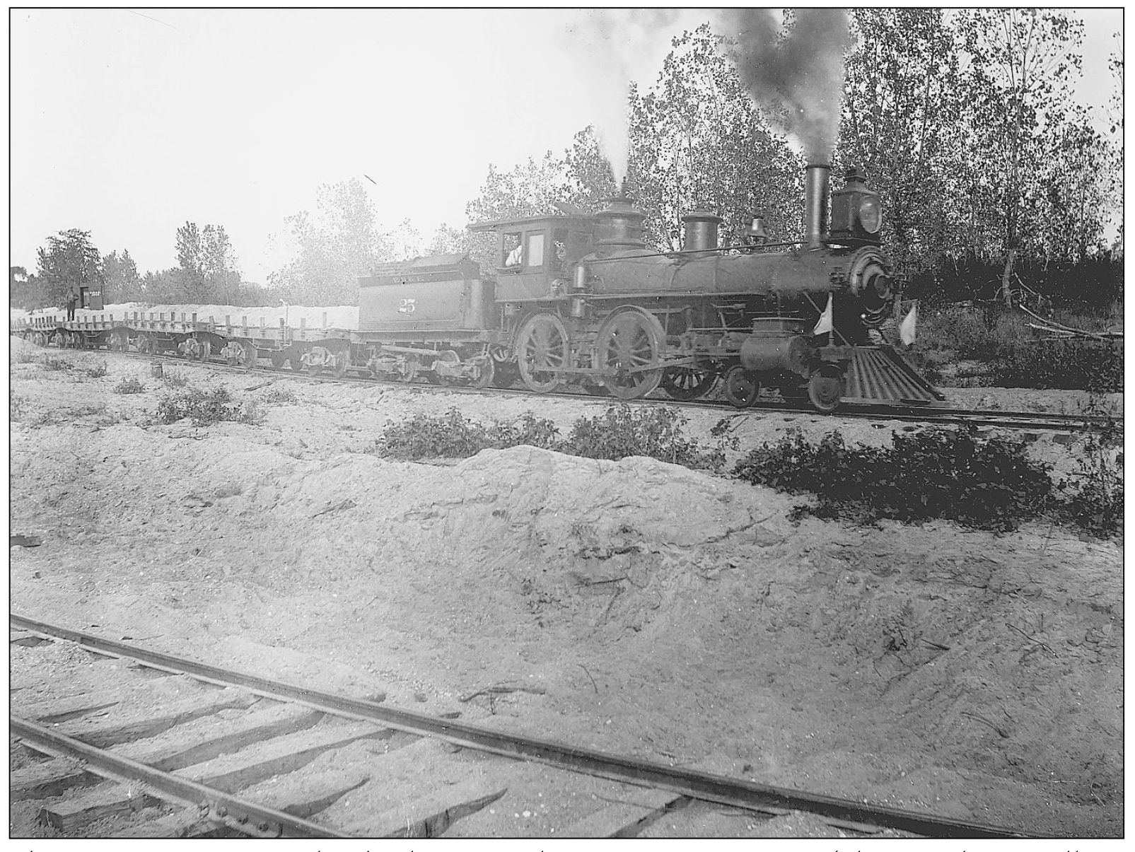 This train appears to be hauling gravel on its many cars Photographer - photo 13