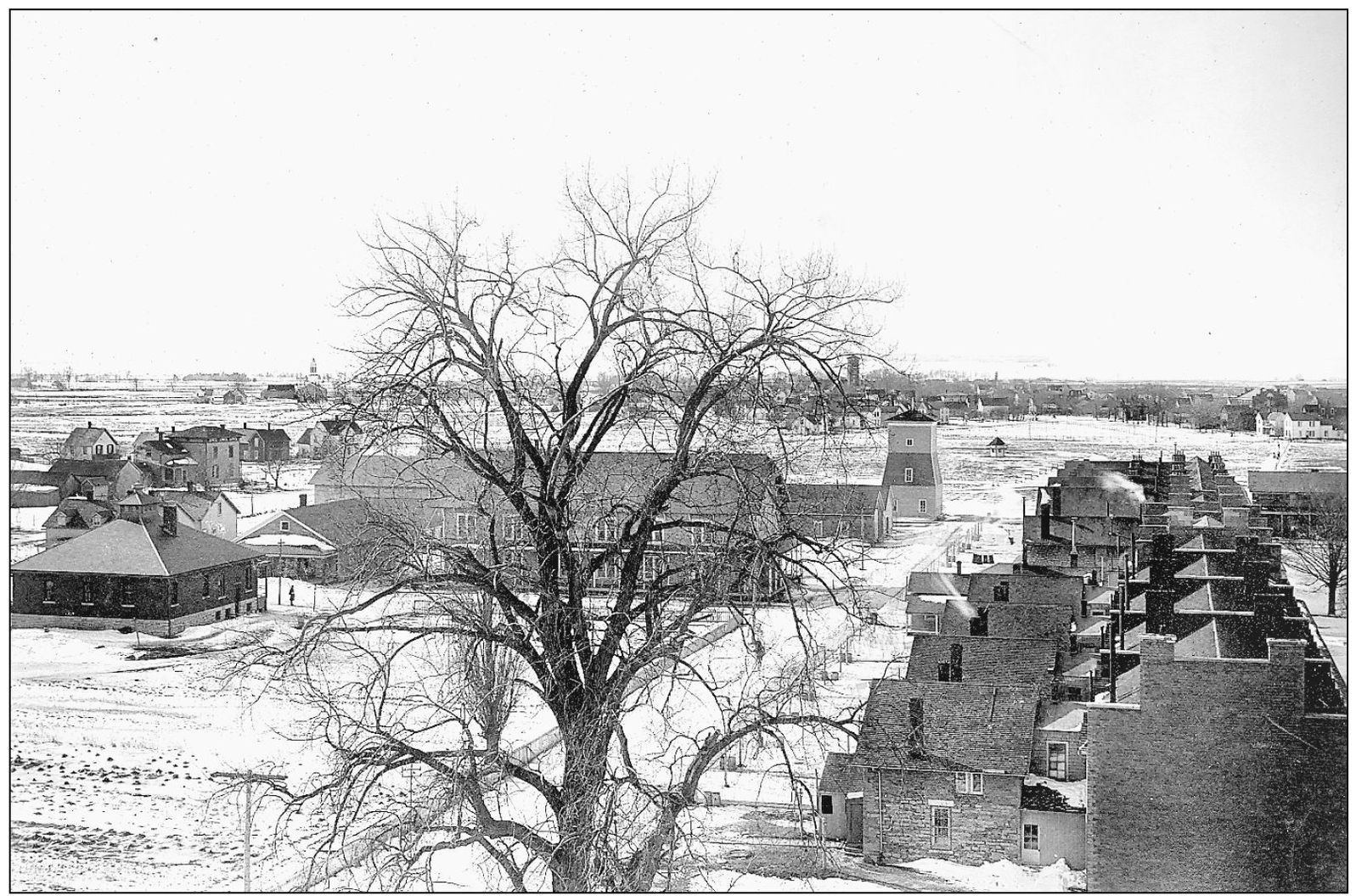 A 1902 photograph of Madison Barracks taken from the stone water tower looks - photo 7